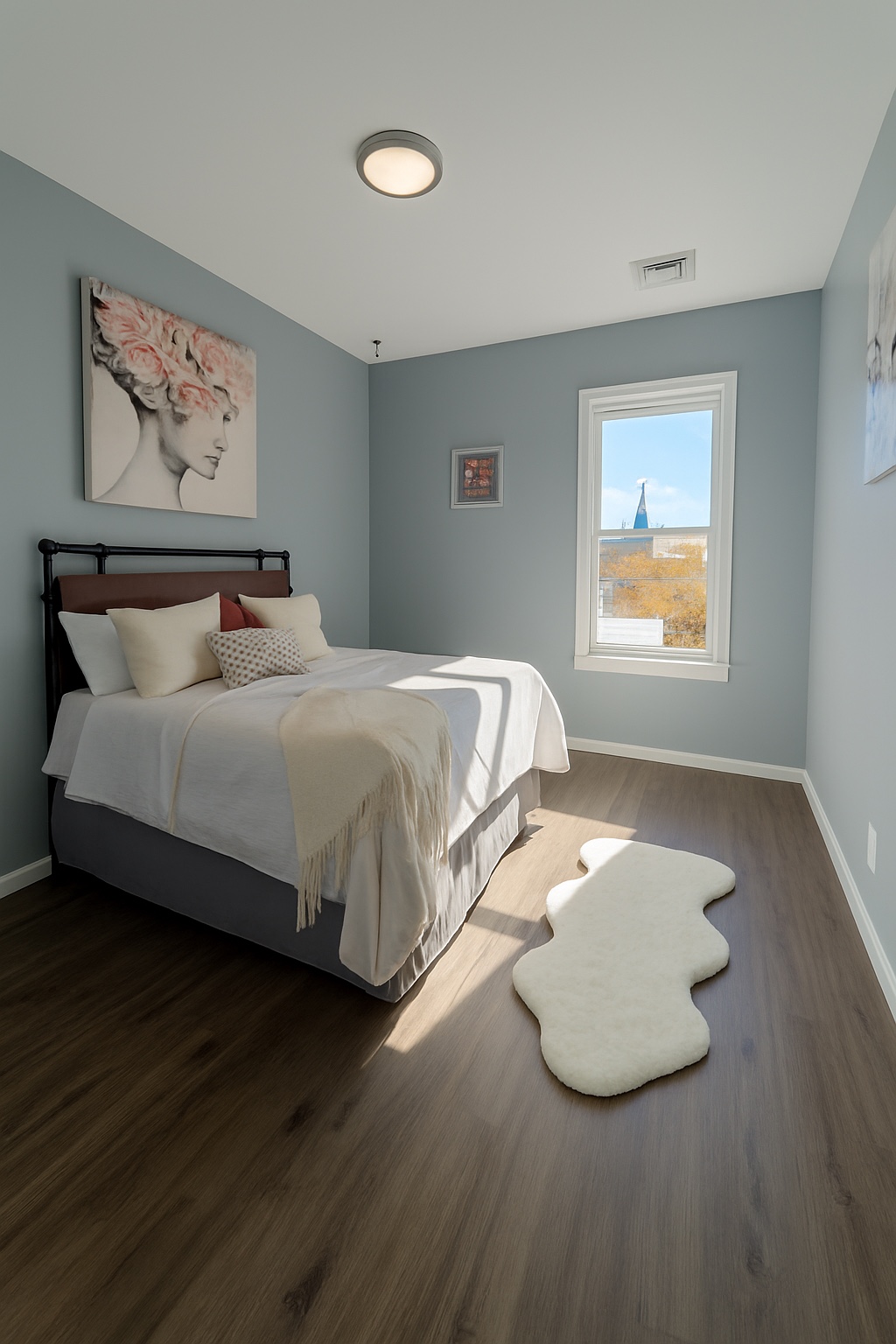 Cozy bedroom with soft gray walls and morning light